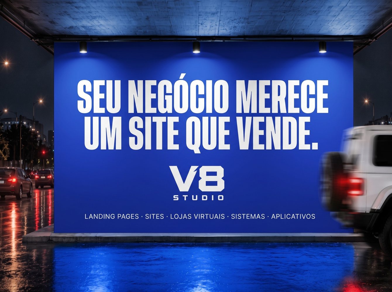 Outdoor azul à noite numa avenida, com a frase Seu negócio merece um site que vende e a marca V8 Studio.